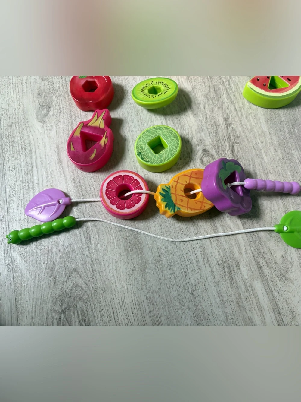 Preschool learning toy - threading, shapes, fruit